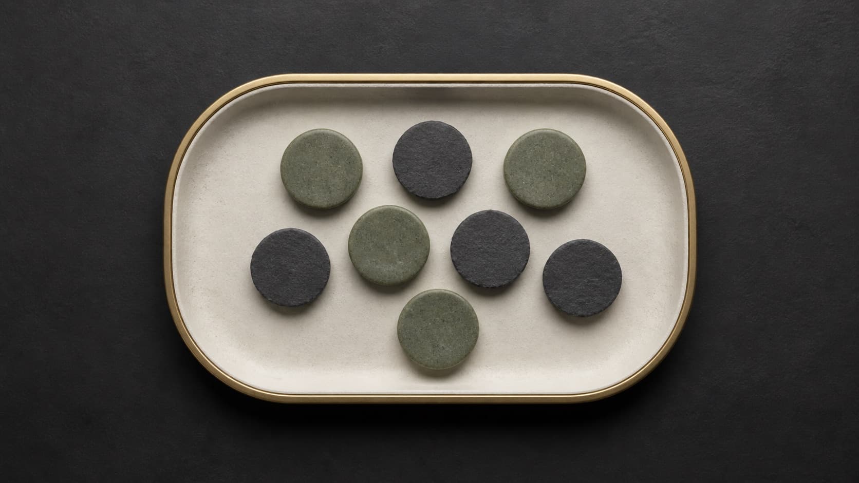 Seven neutral markers sit inside one bounded review tray.